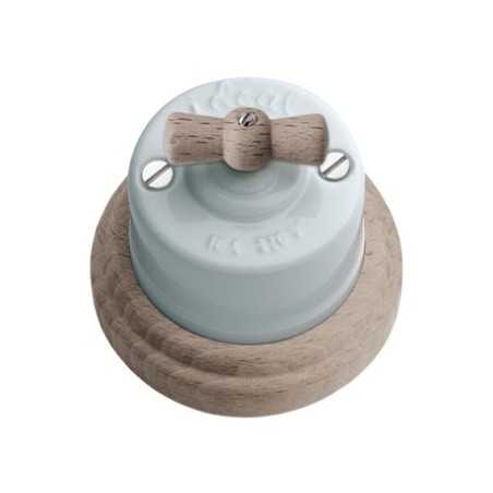 Commutateur en porcelaine, base de surface et boucle en bois naturel.