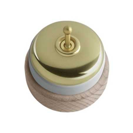 Commutateur en porcelaine avec base en bois naturel et couvercle doré.